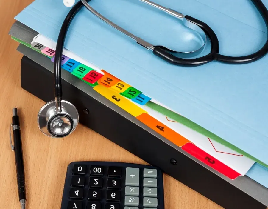 File folder on desk with stethoscope resting on top